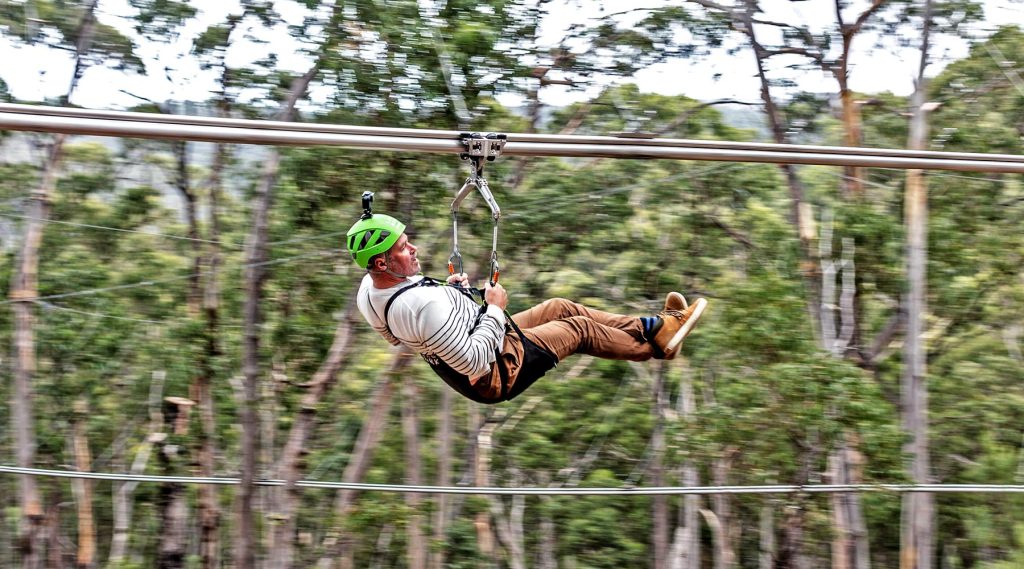 Rider experiencing the thrill of the Shockwave Zip Coaster in Lorne